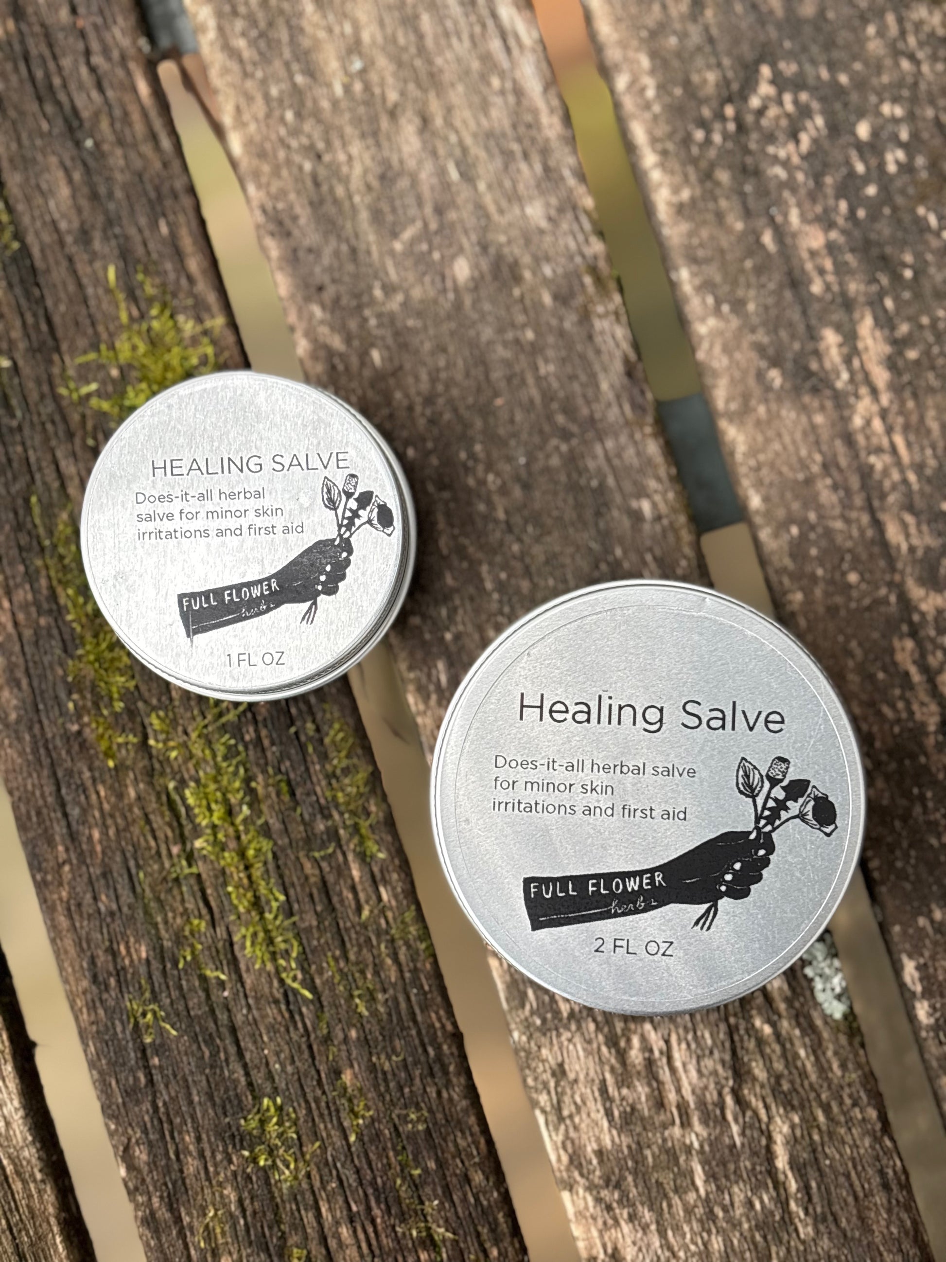 Two tins of Healing Salve, a one ounce and a two ounce tin of our does-it-all herbal salve for healing wounds, burns, rashes, skin irritation, sores, and more